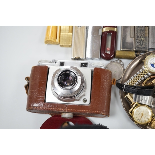 446 - A collection of mixed wristwatches and cigarette lighters and a camera