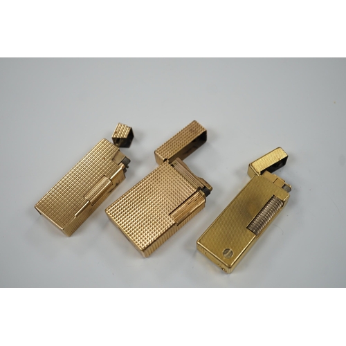 450 - Three Dupont gilt metal lighters