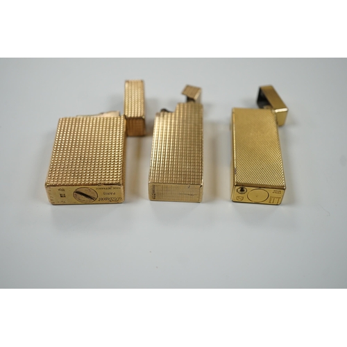 450 - Three Dupont gilt metal lighters