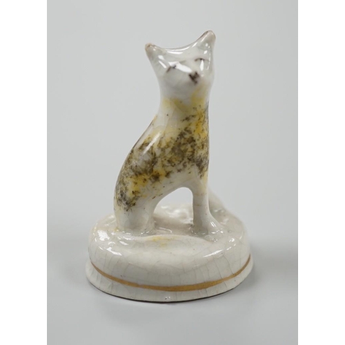 455 - A seated toy Staffordshire model of a cat with tortoiseshell markings, c.1830-50. 4.5cm tallProvenan... 