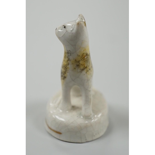 455 - A seated toy Staffordshire model of a cat with tortoiseshell markings, c.1830-50. 4.5cm tallProvenan... 