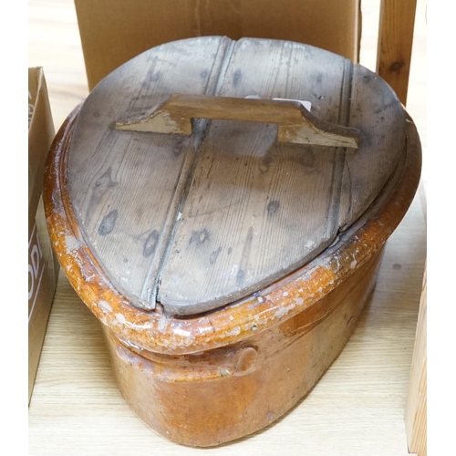 472 - A 19th Century French terracotta ham-smoking pot with original wooden lid.