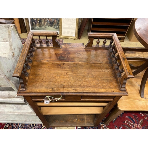 49 - An early 20th century French oak clerk's desk, width 70cm, depth 50cm, height 112cm