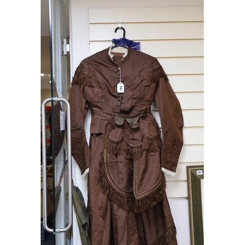 490 - A Victorian brown silk ladies suit skirt and jacket and fronter to the skirt