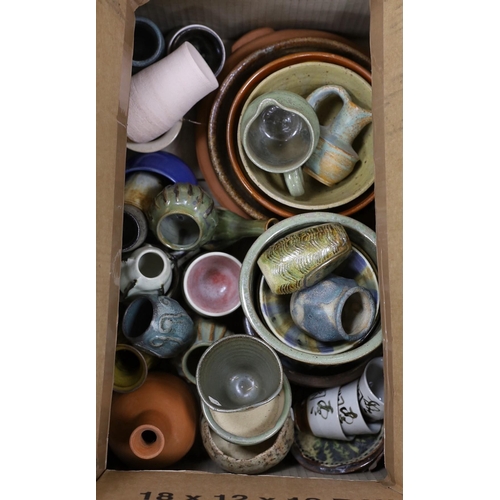 493 - A large quantity of mixed studio pottery bowls, vases, etc.