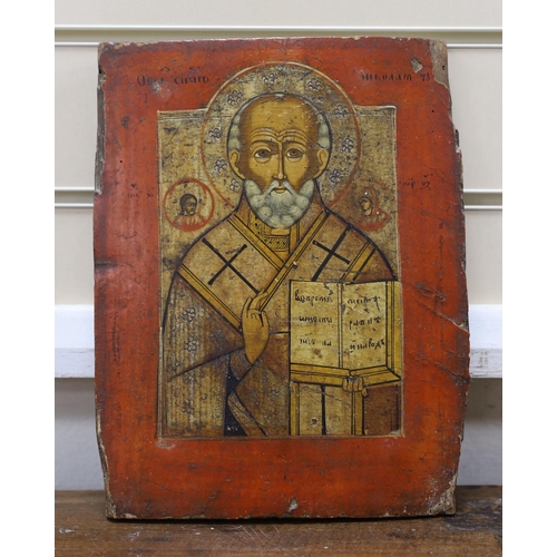 694 - 19th century South Russian School, tempera on wooden panel, Icon of St. Nicholas holding the scriptu... 