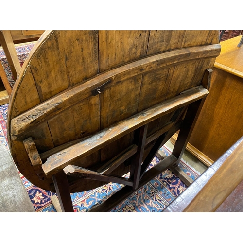 70 - A 19th century French circular fruitwood folding dining table, diameter 101cm, height 74cm