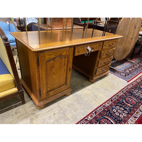 72 - A reproduction French style oak kneehole desk, length 166cm, depth 69cm, height 79cm