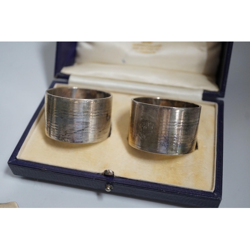 809 - A group of silver including a George V silver inkstand, 17.7cm, a cased pair of napkin rings and two... 