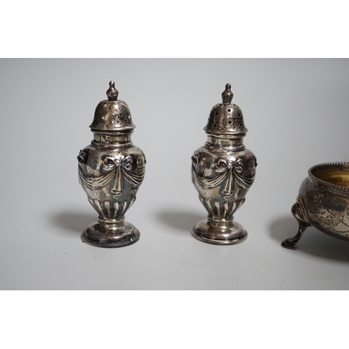 810 - A pair of Victorian silver bun salts, London, 1868,  diameter 5cm and a pair of Victorian silver pep... 