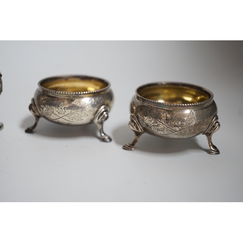 810 - A pair of Victorian silver bun salts, London, 1868,  diameter 5cm and a pair of Victorian silver pep... 