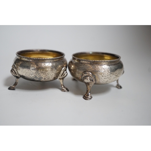 810 - A pair of Victorian silver bun salts, London, 1868,  diameter 5cm and a pair of Victorian silver pep... 