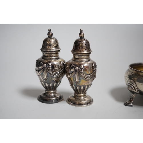 810 - A pair of Victorian silver bun salts, London, 1868,  diameter 5cm and a pair of Victorian silver pep... 