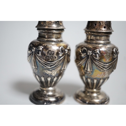 810 - A pair of Victorian silver bun salts, London, 1868,  diameter 5cm and a pair of Victorian silver pep... 