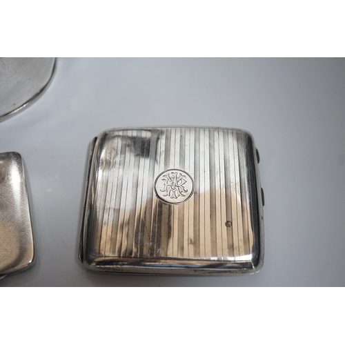 811 - A George V silver oval teapot, Birmingham, 1913,  three silver cigarette cases and a silver matchbox... 