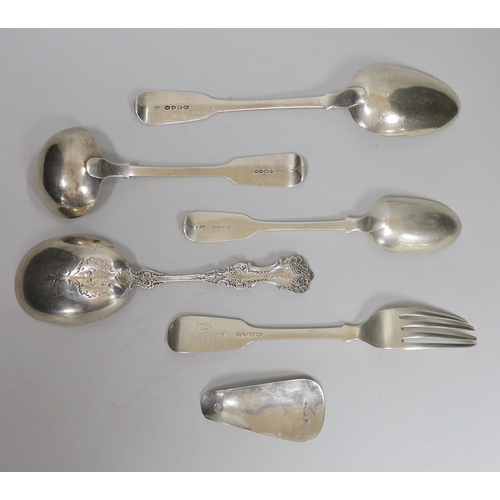 814 - Four assorted items of silver flatware, a sterling serving spoon and a George V silver shoe horn (la... 