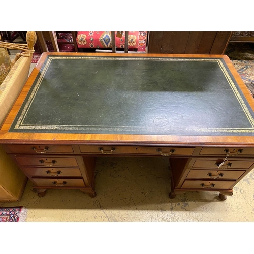 82 - A reproduction George III style walnut pedestal desk, length 152cm, depth 91cm, height 77cm