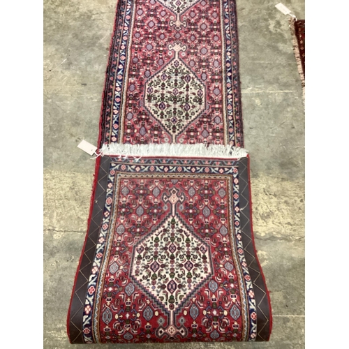 84 - A North West Persian red ground runner, 366 x 55cm