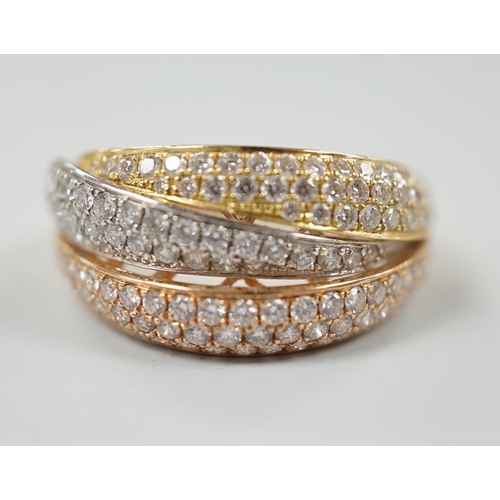 882 - A modern three colour 18ct gold and diamond chip cluster set three row crossover ring, size O, gross... 