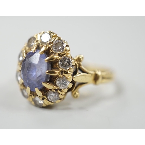 883 - An early to mid 20th century yellow metal, sapphire and diamond set oval cluster dress ring, size... 