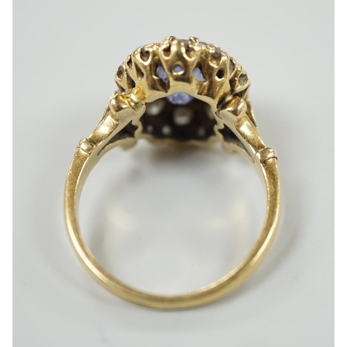 883 - An early to mid 20th century yellow metal, sapphire and diamond set oval cluster dress ring, size... 