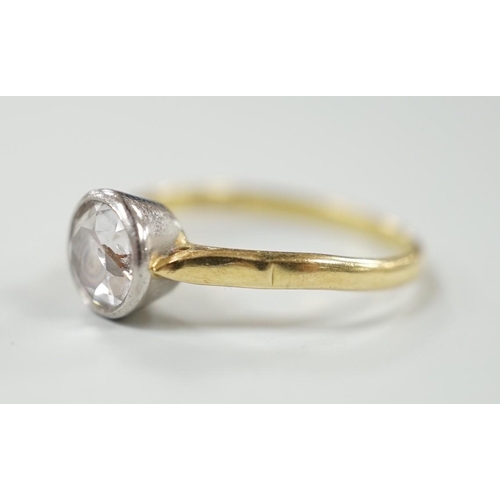 884 - A modern 18ct gold and collet set solitaire diamond ring, size N, gross weight 3.1 grams, the stone ... 