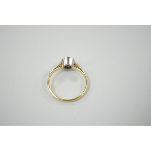 884 - A modern 18ct gold and collet set solitaire diamond ring, size N, gross weight 3.1 grams, the stone ... 