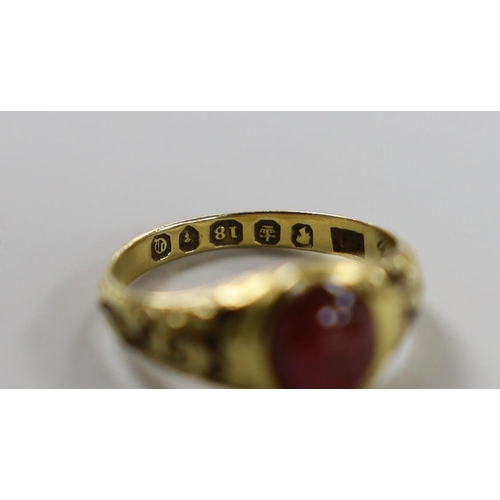 886 - A Victorian 18ct gold, cabochon garnet and black enamel set memorial ring, the shank interior inscri... 