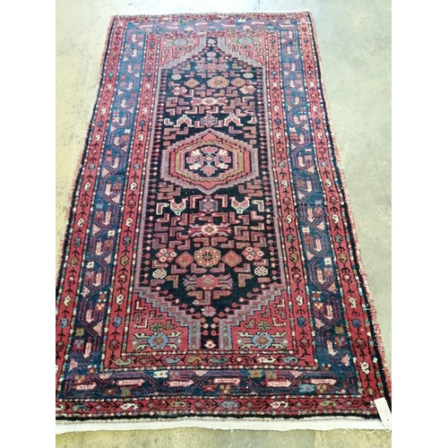 97 - A Caucasian blue ground rug, 200 x 110cm