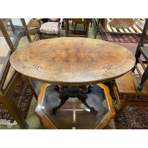 1018 - A Victorian inlaid walnut oval centre table, width 107cm, depth 64cm, height 72cm