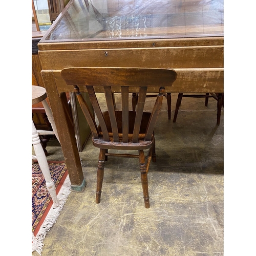 1044 - A set of six Victorian elm and beech Windsor lathe back kitchen chairs together with a circular part... 