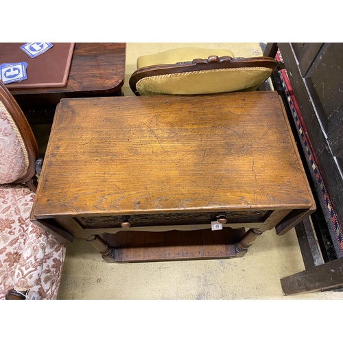 1057 - An 18th century style oak drop flap two tier side table, width 78cm, depth 42cm, height 77cm