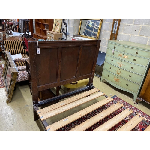 1058 - An 18th century style panelled oak bedframe, length 198cm, width 122cm, height 130cm