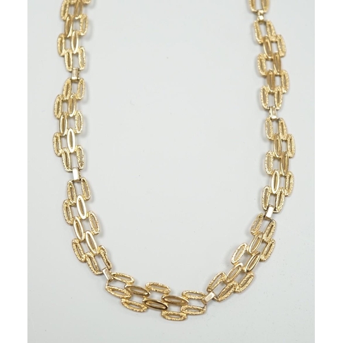 1890 - A 9ct gold pierced fancy link necklace, 45cm, 11 grams.