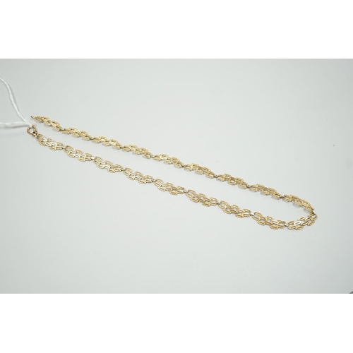 1890 - A 9ct gold pierced fancy link necklace, 45cm, 11 grams.