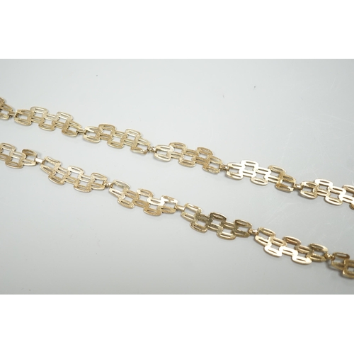 1890 - A 9ct gold pierced fancy link necklace, 45cm, 11 grams.