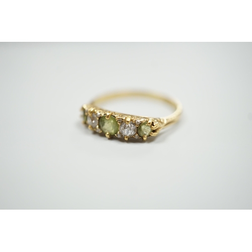 1892 - An 18ct, three stone peridot and two stone diamond set half hoop ring. size N, gross weight 2.6 gram... 