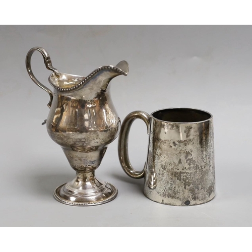 1823 - A George III silver inverted pear shaped cream jug, marks rubbed, 72mm and a later silver christenin... 