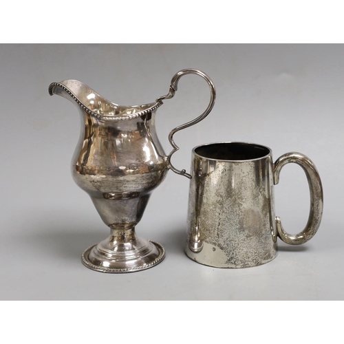 1823 - A George III silver inverted pear shaped cream jug, marks rubbed, 72mm and a later silver christenin... 