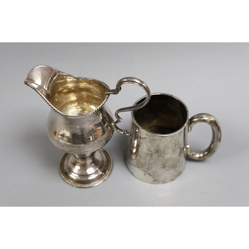 1823 - A George III silver inverted pear shaped cream jug, marks rubbed, 72mm and a later silver christenin... 