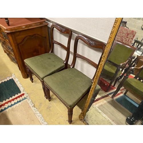 10 - A set of eight early Victorian mahogany dining chairs on turned fluted legs