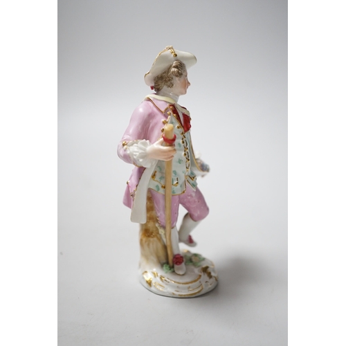 448 - A Meissen figure of a young man with walking stick and his tail full of flowers, late 18th century, ... 