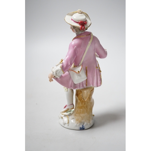 448 - A Meissen figure of a young man with walking stick and his tail full of flowers, late 18th century, ... 