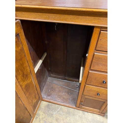 45 - An early 20th century 'S.B.S.' furniture oak compactum with hinged mirrored top, width 102cm, depth ... 