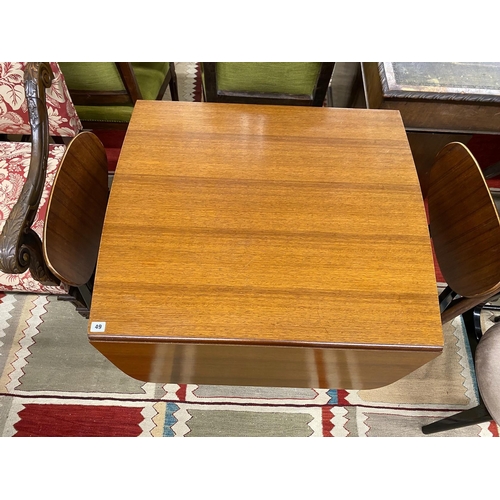 49 - A 1950's G-plan table, approx. 150cm extended, width 82cm, height 72cm and four chairs