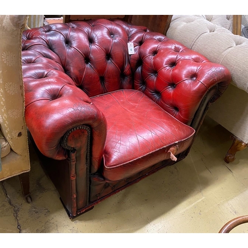 94 - A Victorian style red leather button back Chesterfield armchair, width 104cm, depth 86cm, height 68c... 