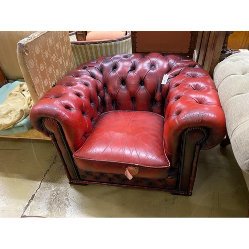 94 - A Victorian style red leather button back Chesterfield armchair, width 104cm, depth 86cm, height 68c... 