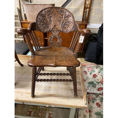 98 - A 19th century Continental carved oak tub framed elbow chair on turned spiral underframe, width 65cm... 