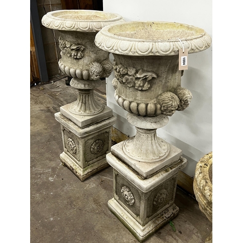 1004 - A pair of reconstituted stone campana garden urns on square pedestals, diameter 49cm, height 108cm... 