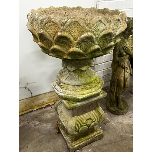 1007 - A reconstituted stone circular garden planter on square plinth, diameter 52cm, height 89cm